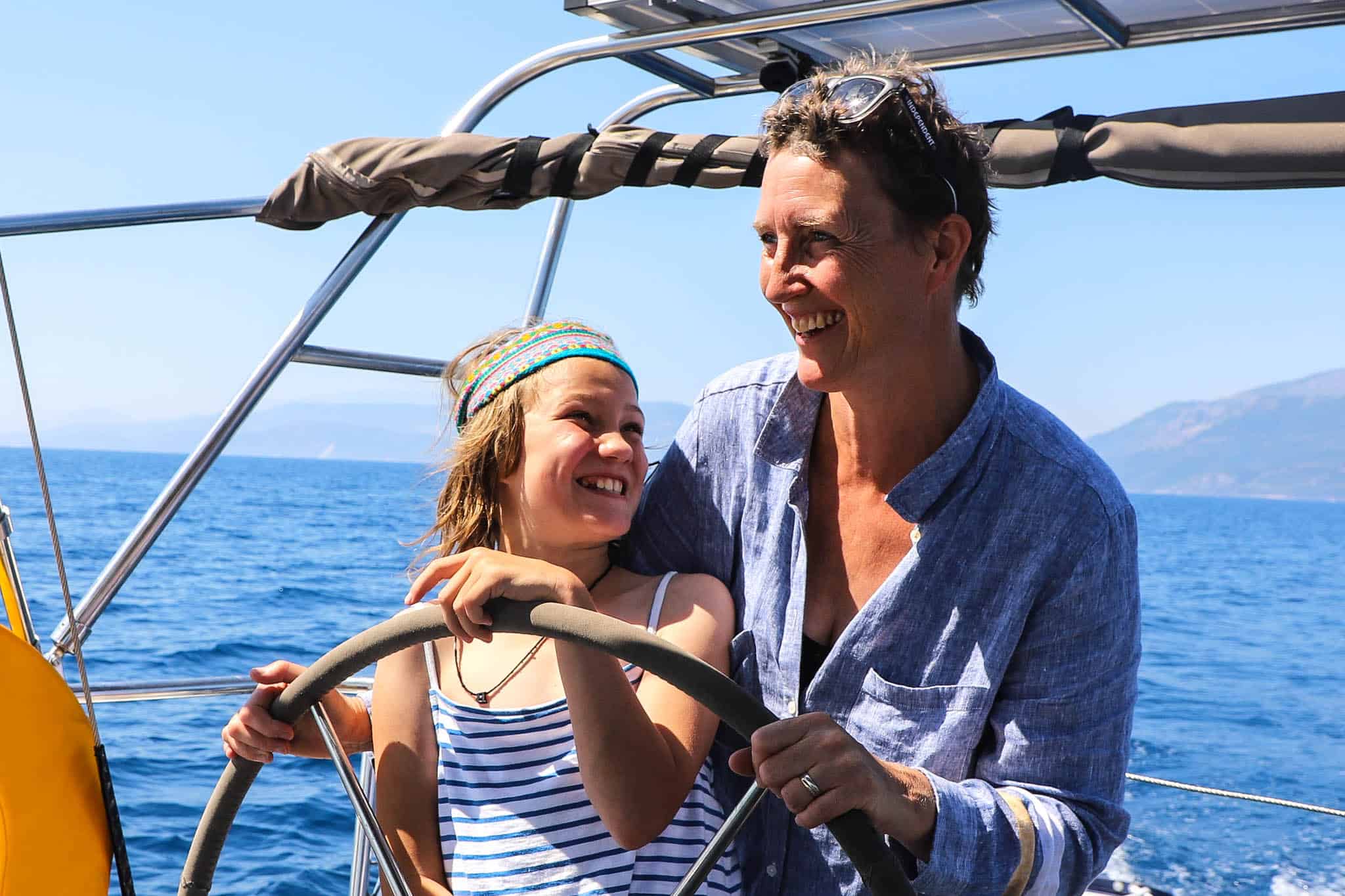 family sailing in greece